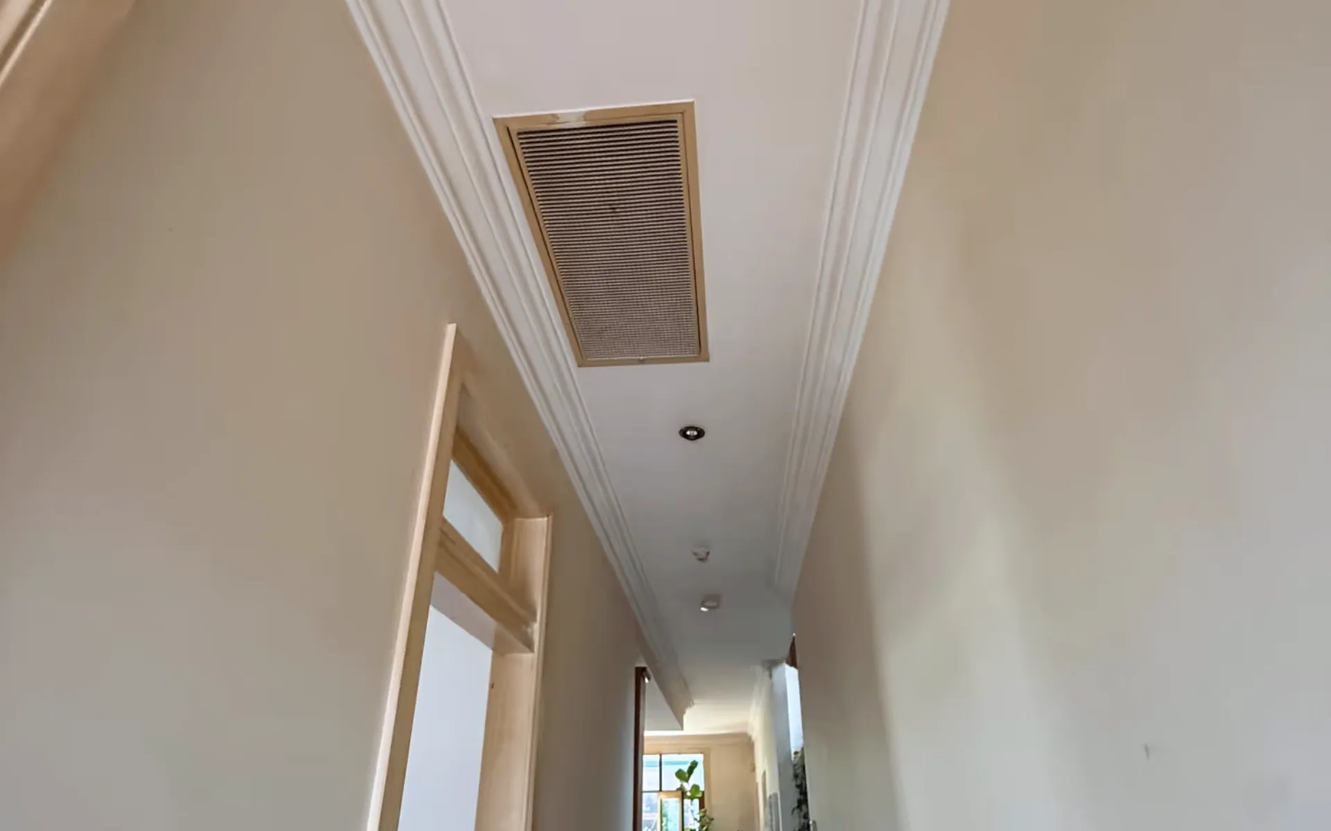 Hallway after nicotine clean-up showing removal of nicotine staining and smoke residue, restoring clean and bright walls, trims, and surfaces.