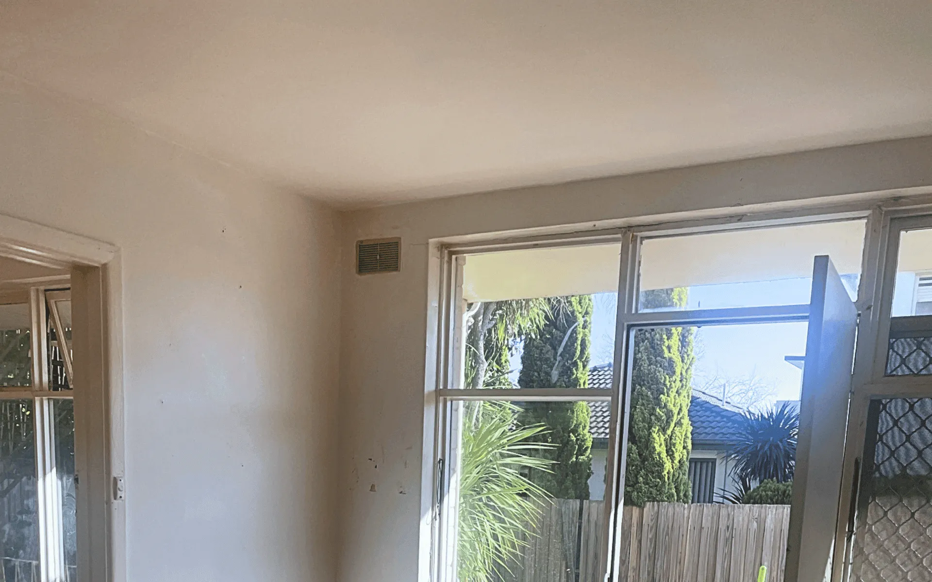 highlights the results after a comprehensive cleanup and odour removal process. The interior walls and ceiling are now a bright, clean white, completely stripped of the heavy discolouration and dark residue seen previously.