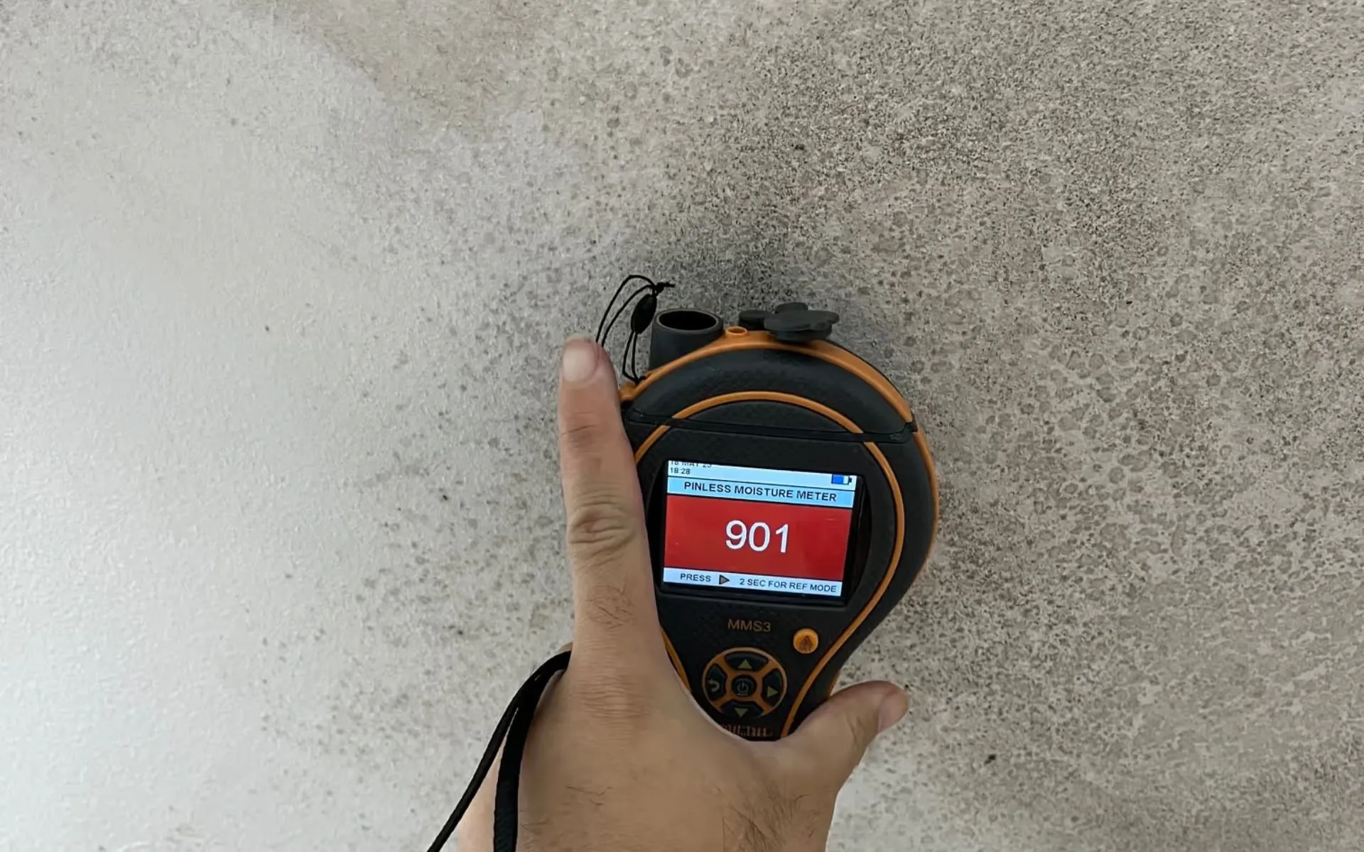 Technician testing wall moisture for mould removal in Ballarat using a Protimeter MMS3 meter for AllAces Mould Removal Services