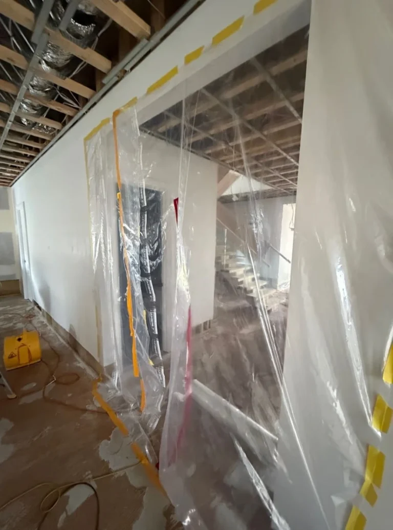 Professional containment barrier installed during structural water damage restoration in Sydney.